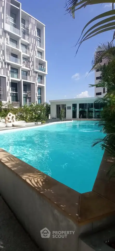 Luxurious apartment complex with stunning pool and modern architecture