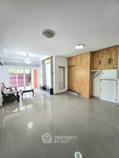 Spacious living room with modern design and ample natural light