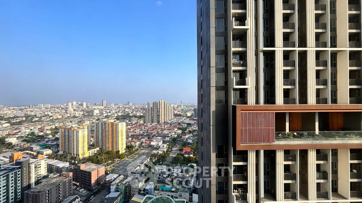 Stunning cityscape view from a modern high-rise building balcony, showcasing urban living at its finest.