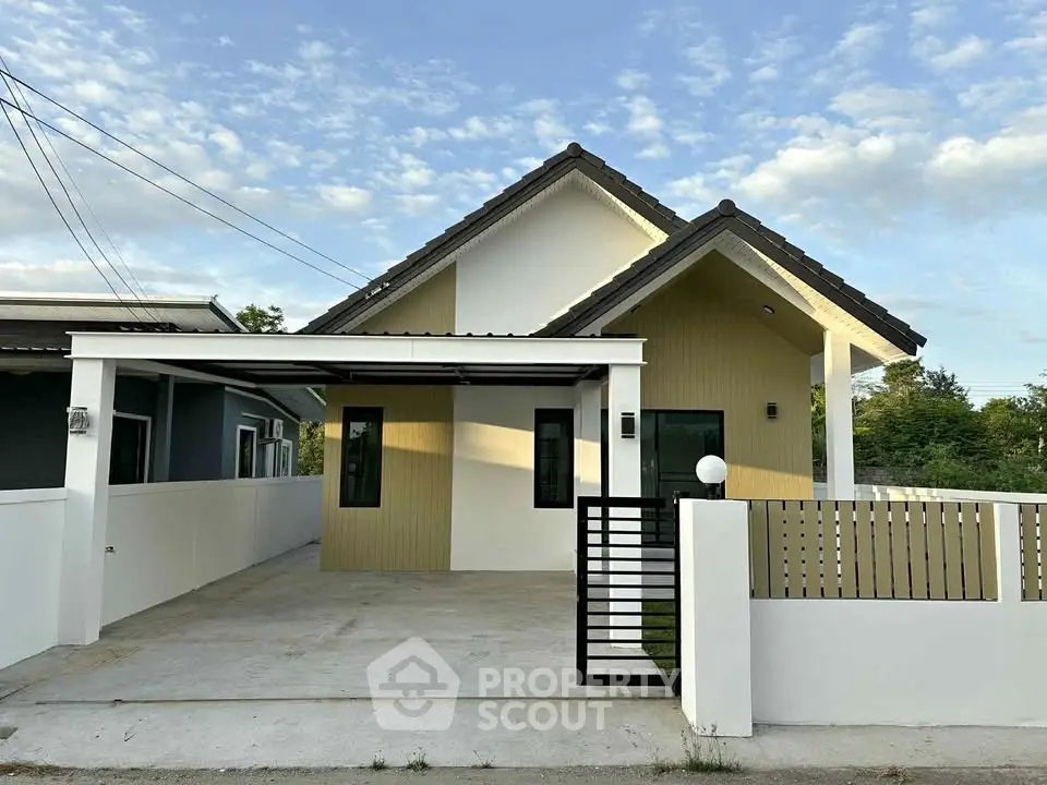 Charming modern single-story house with spacious driveway and stylish facade.