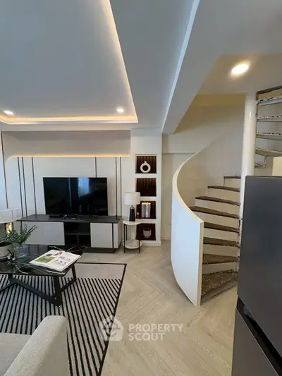 Modern living room with stylish spiral staircase and sleek TV setup