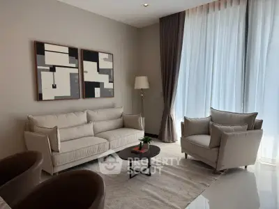 Elegant living room with modern furniture and large windows for natural light.