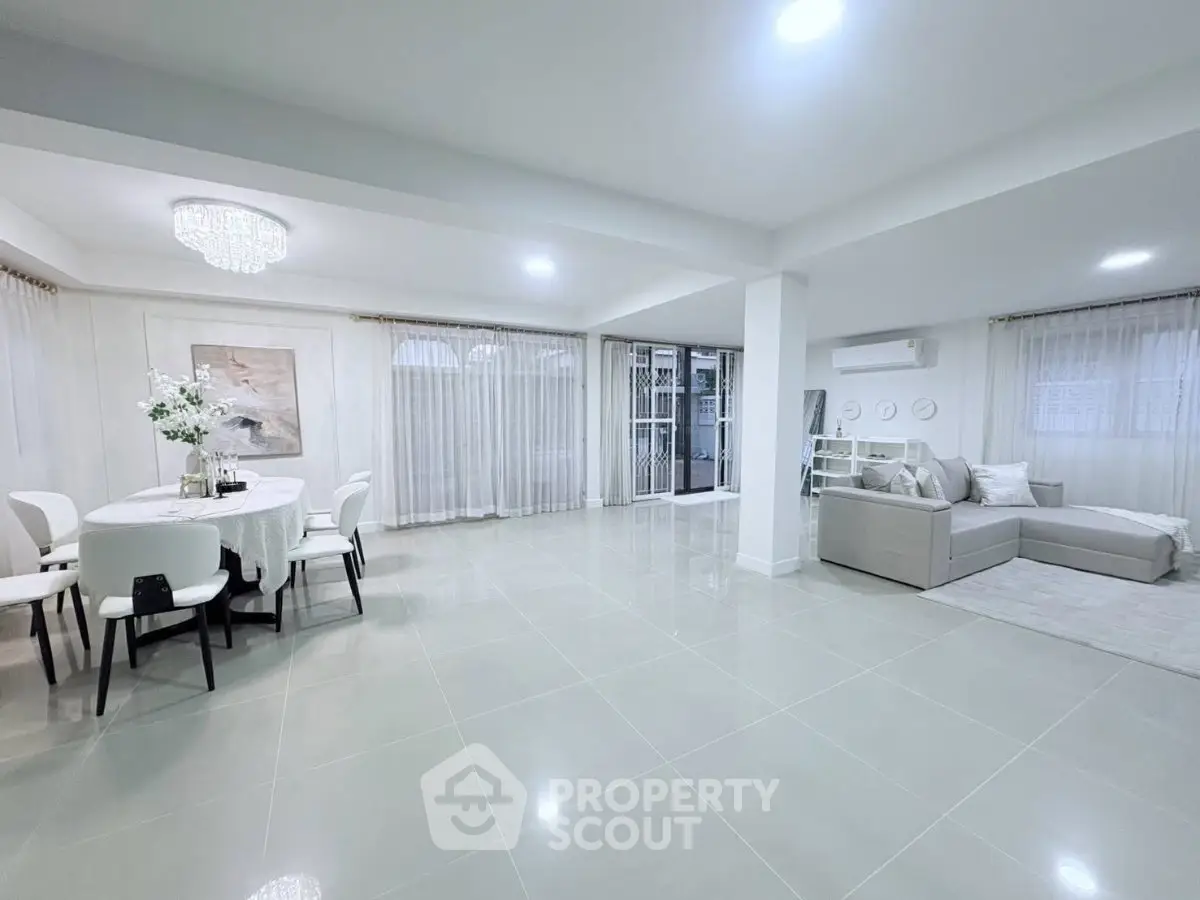 Spacious modern living room with elegant dining area and chic decor