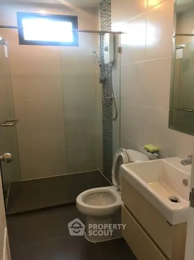 Modern bathroom with sleek design and glass shower enclosure