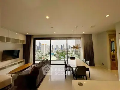 Spacious modern living room with city view, elegant decor, and large windows.