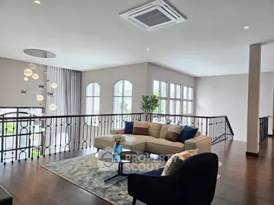 Luxurious living room with elegant decor and large windows