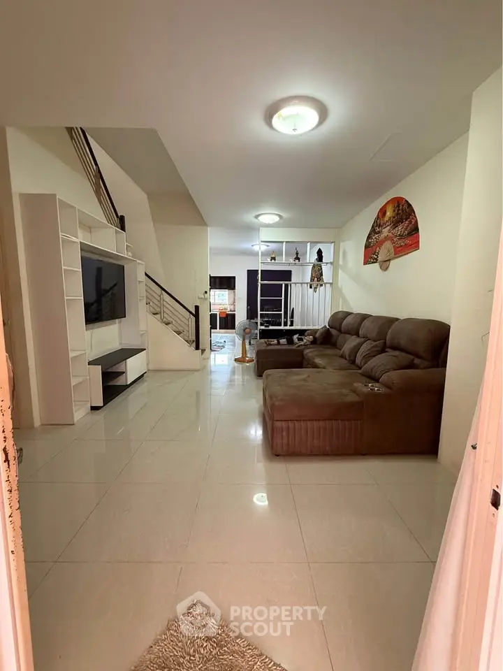 Spacious living room with modern decor and large sectional sofa