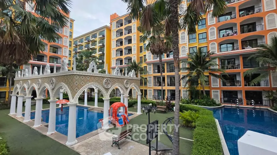 Luxurious apartment complex with stunning pool and lush landscaping