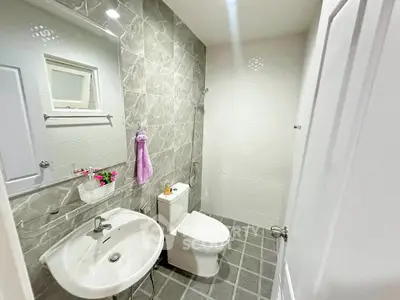 Modern bathroom with sleek design and elegant gray tiles