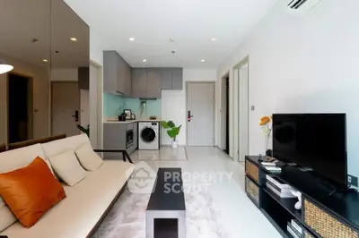 Modern living room with open kitchen and stylish decor