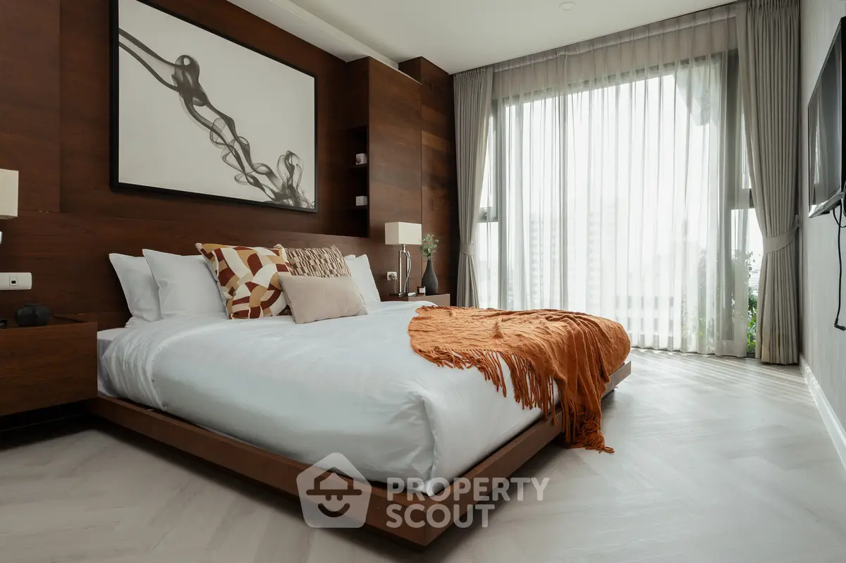 Luxurious modern bedroom with elegant decor and large window view