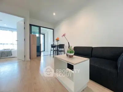 Modern living room with sleek furniture and open layout, perfect for urban living.