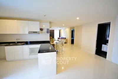 Spacious modern kitchen with open layout and sleek white cabinetry