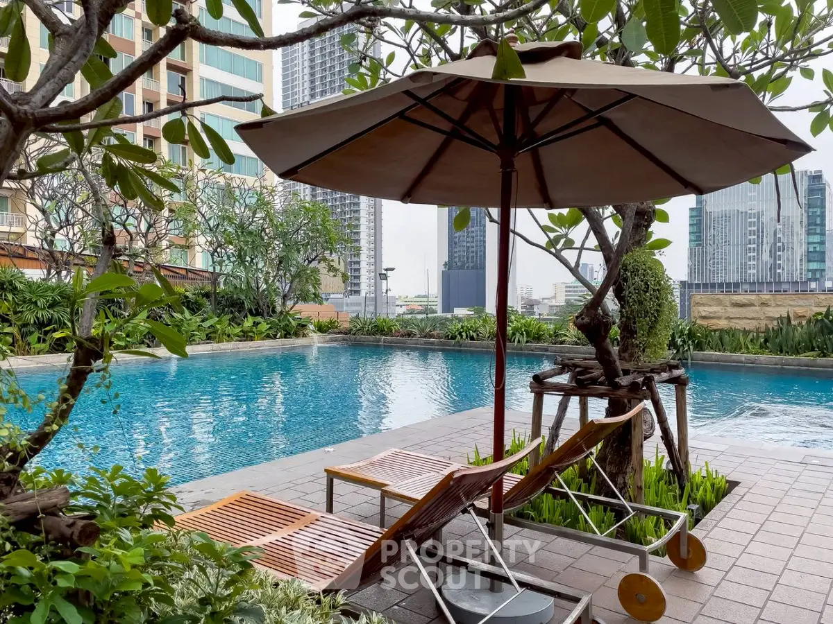 Luxurious urban poolside retreat with lush greenery and city skyline views.