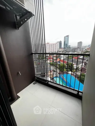 Modern balcony with city view in high-rise apartment