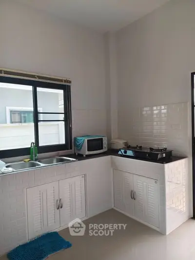 Modern kitchen with sleek countertops and gas stove