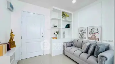 Modern living room with elegant decor and cozy gray sofa
