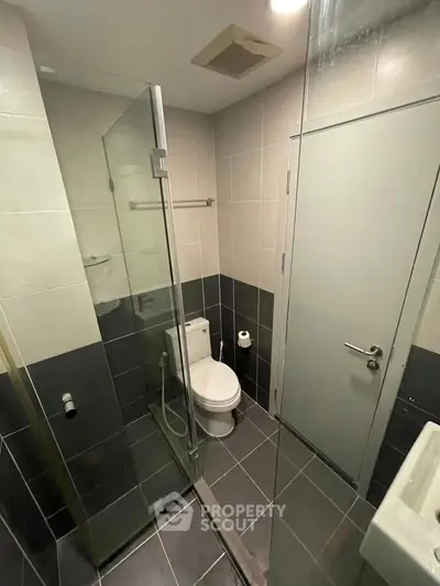 Modern bathroom with glass shower and sleek tile design