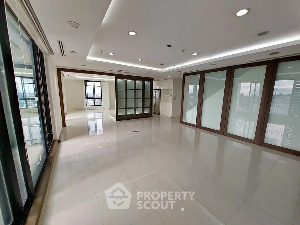 Spacious modern living room with large windows and sleek design