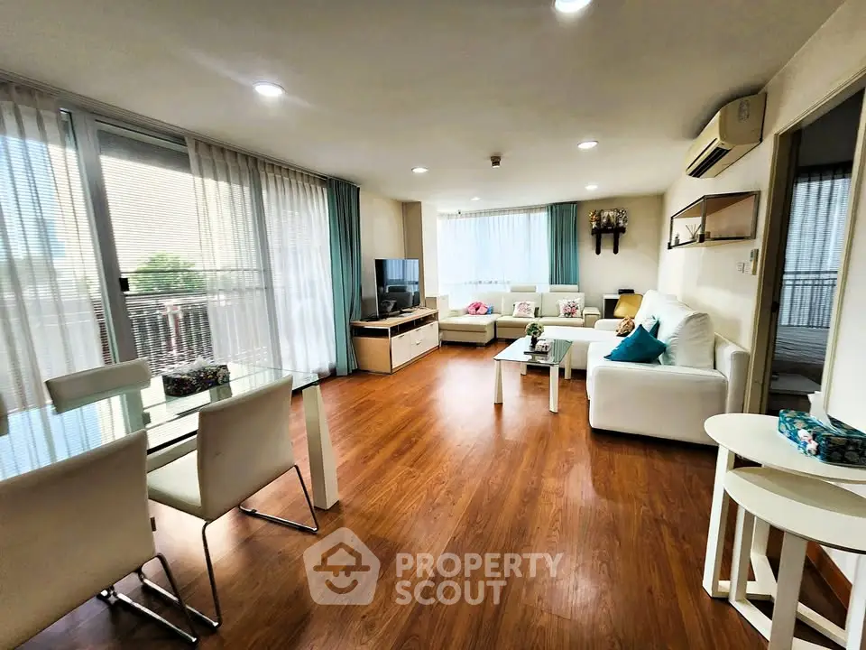 Spacious living room with modern decor and natural light