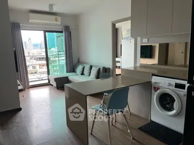 Modern apartment with open layout, featuring a cozy living area and washing machine, city view balcony.