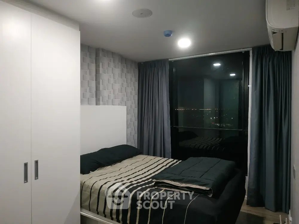 Modern bedroom with city view and stylish decor