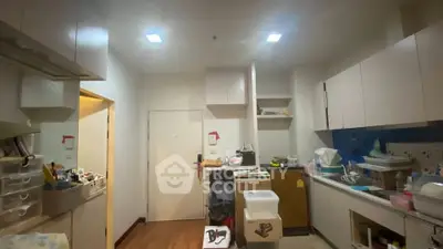 Cozy kitchen with modern cabinetry and wooden flooring, perfect for culinary enthusiasts.