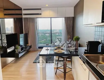 Modern open-plan living room with kitchen and city view balcony