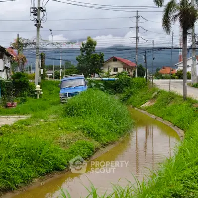 Charming rural property with lush greenery and scenic mountain views, perfect for tranquil living.