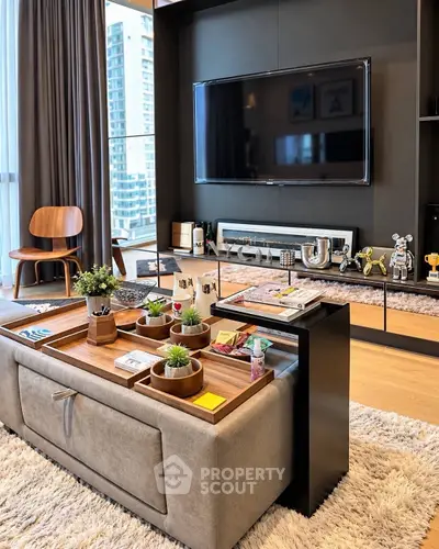 Modern living room with stylish decor and large TV in luxury apartment