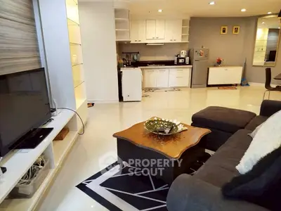 Spacious living room with modern kitchen in open layout apartment