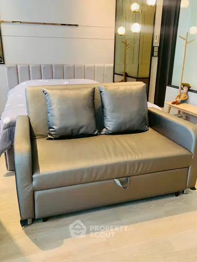 Modern bedroom with stylish sofa bed and elegant lighting