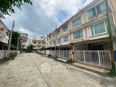 Charming townhouse complex with modern architecture and spacious balconies in a serene neighborhood.