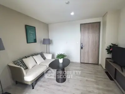 Modern living room with stylish decor and cozy seating area, perfect for relaxation and entertainment.