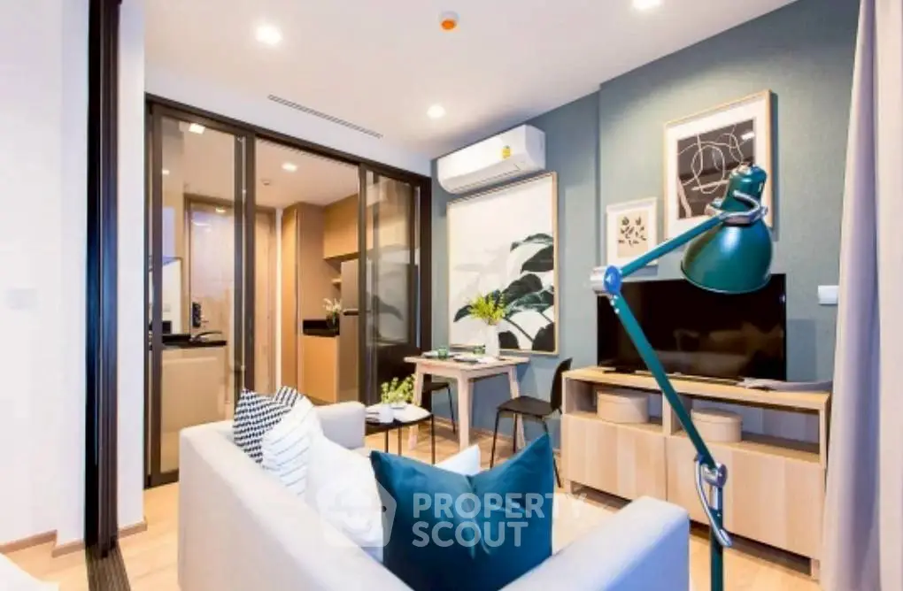 Modern living room with stylish decor and open kitchen layout