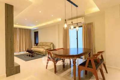 Spacious modern living room with elegant dining area and stylish lighting