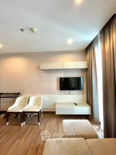 Modern living room with mounted TV and stylish furniture