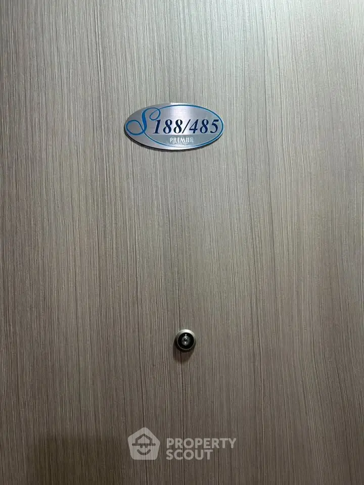 Stylish modern apartment door with peephole and sleek wood finish, perfect for urban living.