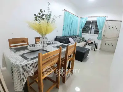 Charming living room with dining area, cozy seating, and elegant decor, perfect for family gatherings.