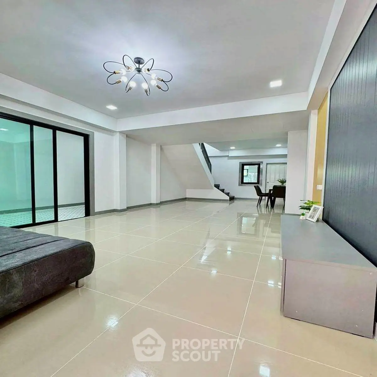 Spacious modern living room with sleek design and elegant lighting