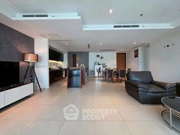 Spacious modern living room with open kitchen and elegant decor