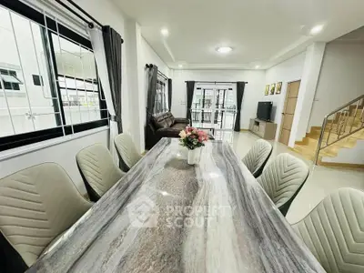 Spacious modern living room with elegant dining area and stylish decor