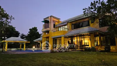 Luxurious modern villa with expansive garden and pool at dusk