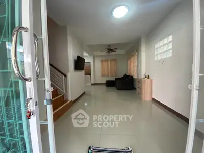 Spacious living room with modern decor and natural light