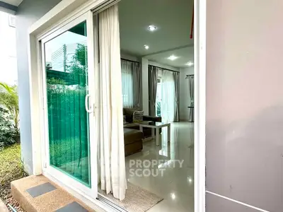 Modern living room with sliding glass doors and garden view