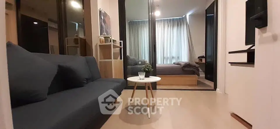 Modern apartment interior with cozy living room and bedroom view