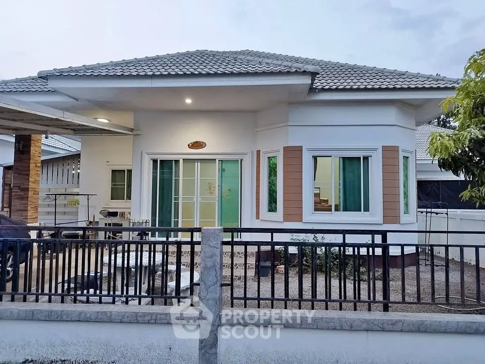 Charming single-story house with modern design and spacious outdoor area.