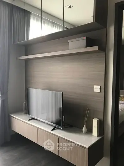 Modern living room with sleek TV unit and elegant decor