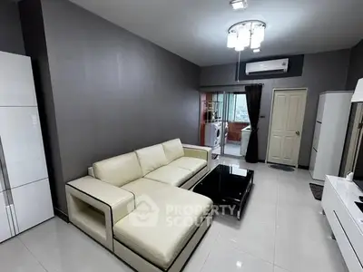 Modern living room with sleek white sofa and contemporary decor