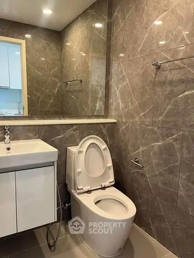 Modern bathroom with elegant marble tiles and sleek fixtures